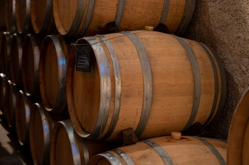 Keeping for years of dry red wine in new oak barrels in caves in Burgundy, made from pinot noir grape