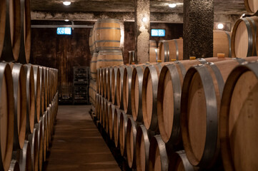 Keeping for years of dry red wine in new oak barrels in caves in Burgundy, made from pinot noir...