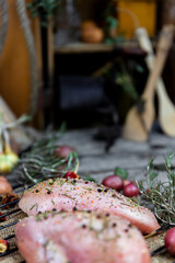  Fresh raw chicken breast with herbs and spices in the kitchen