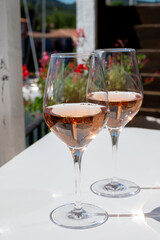 Summer on French Riviera Cote d'Azur, drinking cold rose wine from Cotes de Provence on outdoor terrase in Port Grimaud, Var, France
