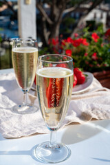 Summer party, pouring of French champagne sparkling wine in glasses in yacht harbour of Port Grimaud near Saint-Tropez, French Riviera vacation, France