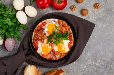 Georgian dish, scrambled eggs Chirbuli, top view, on a gray table, homemade, horizontal, no people,