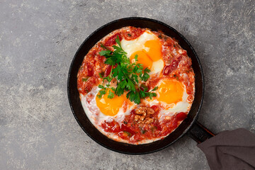 Georgian dish, scrambled eggs Chirbuli, top view, on a gray table, homemade, horizontal, no people,