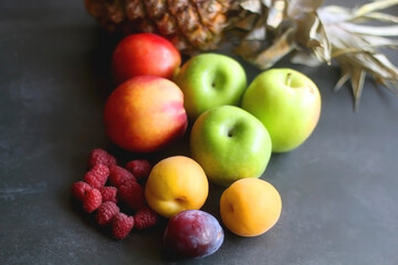 Various colorful fruit on dark background. Selective focus.