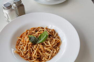 Dish of pasta on round white plate