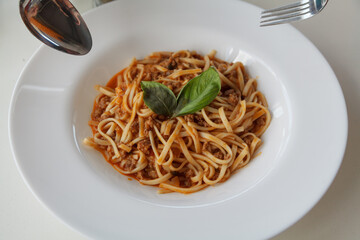 Dish of pasta on round white plate