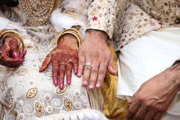 Newly wedding couple with a ring on their fingers. Asian wedding culture.