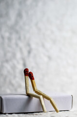 Two Romantic Matchsticks Burning In Love Sitting together. Love And Romance Concept. Matchstick art...