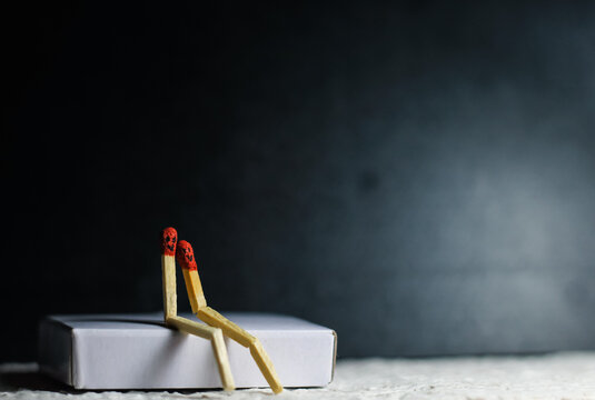 Two Romantic Matchsticks Burning In Love Sitting together. Love And Romance Concept. Matchstick art photography used matchsticks to create the character.
