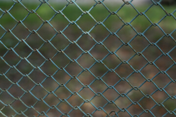 Fototapeta premium closeup blue seamless fence chain, Iron wire fence