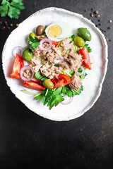 tuna salad vegetables tomato, onion, herbs, olives other canned tuna fish seafood on the table, healthy meal copy space food background top view keto or paleo diet veggie vegetarian food pescetarian 