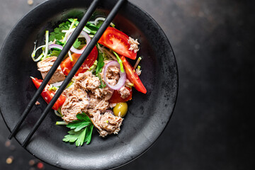 tuna salad vegetables tomato, onion, herbs, olives other canned tuna fish seafood on the table, healthy meal copy space food background top view keto or paleo diet veggie vegetarian food pescetarian 