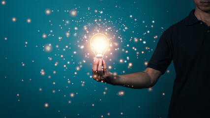 Fototapeta na wymiar hand holding light bulb. idea concept with innovation and inspiration