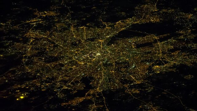 Moving lights on city at night aerial satellite view, animation  of Moscow by night based on image furnished by Nasa