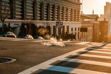 Steam from a manhole on a San Francisco street in the morning