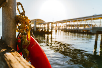 Naklejka premium Lifebuoy on the waterfront in San Francisco, a beautiful morning pier