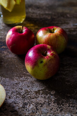 A refreshing jug of apple cider on wood table