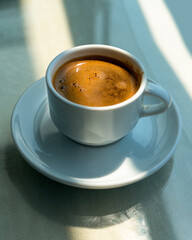 Traditional Turkish coffee in white cup