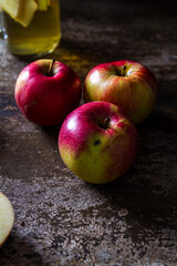 A refreshing jug of apple cider on wood table