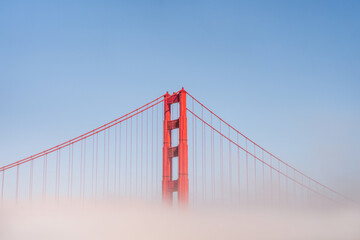 Golden Gate Bridge in the fog, photo taken from the embankment, San Francisco