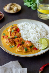 Chicken tikka masala curry with rice, herbs and peppers. Indian food. National cuisine.