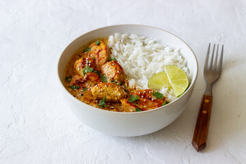 Chicken tikka masala curry with rice, herbs and peppers. Indian food. National cuisine.