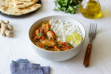 Chicken tikka masala curry with rice, herbs and peppers. Indian food. National cuisine.