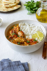 Chicken tikka masala curry with rice, herbs and peppers. Indian food. National cuisine.