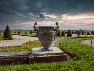 VERSAILLES, FRANCE, MAY, 2021. Sculptures in the shape of vases standing in the gardens of the...