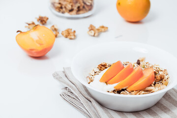 Homemade vegan granola cereal with soy yogurt, walnuts, fuji apple and almond milk.