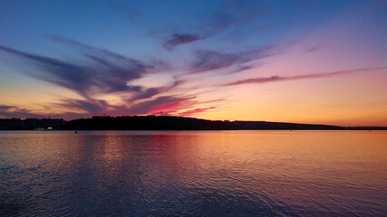 Magic colored sunset on the evening lake