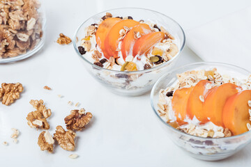 Homemade vegan granola cereal with soy yogurt, walnuts, fuji apple and almond milk.