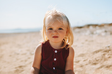 Child girl 2 years old sad face portrait outdoor blonde hair scandinavian people - obrazy, fototapety, plakaty