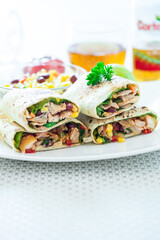 Traditional Mexican Food -  Burrito, on white wooden retro table