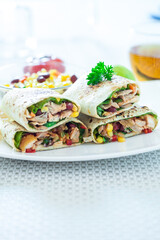 Traditional Mexican Food -  Burrito, on white wooden retro table