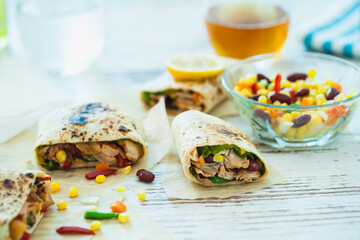 Traditional Mexican Food -  Burrito, on white wooden retro table