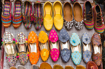 Traditional colorful indian shoes on a market in Jaipur