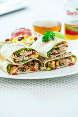 Traditional Mexican Food -  Burrito, on white wooden retro table