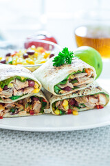 Traditional Mexican Food -  Burrito, on white wooden retro table