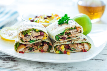 Traditional Mexican Food -  Burrito, on white wooden retro table