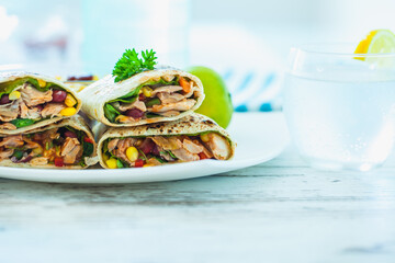 Traditional Mexican Food -  Burrito, on white wooden retro table