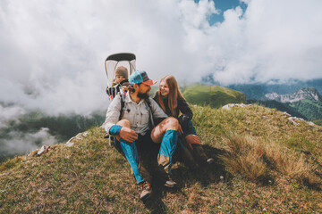 Family having fun in mountains hiking together with baby travel adventure vacations outdoor healthy...