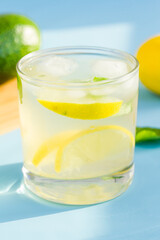 Homemade lemonade on blue background