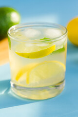 Homemade lemonade on blue background