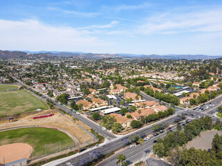 Fototapeta na wymiar Aerial view of San Marcos neighborhood with houses and street during sunny day, California, USA.