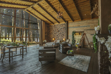dark cozy interior of big country wooden house, wooden furniture and animal furs. huge panoramic...