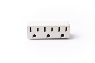 American multi plug socket, three way connector for electrical wall plugs. Power plug isolated on white