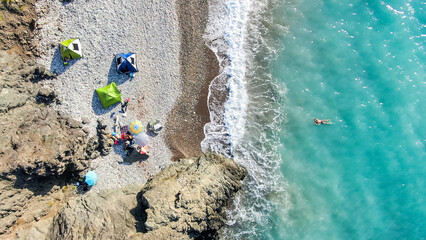 Obraz premium The coast of Cyprus, near the city of Paphos. Top view of the sea, mountains and the beach. Camping, camping with tents in nature.