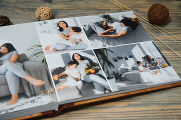 Luxury wooden photo book on natural background. Family memories photobook. Save your summer...