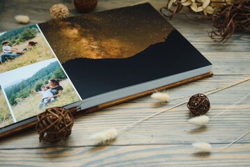 premium photo book, large size, natural wood cover, quality binding. Family photobook, recreation...